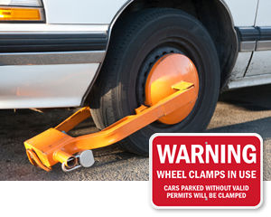 Warning Private parking wheel clamping in operation safety sign 
