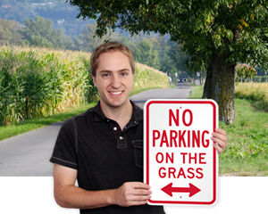 No parking on the grass signs