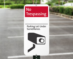 Parking lot security sign
