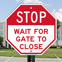 Stop, Wait For Gate To Close Signs