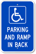 Parking And Ramp In Back With Graphic Sign