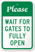 Please Wait For Gates To Open Sign