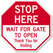 Stop Here Wait For Gate To Open Sign