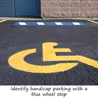 Blue parking stop used for handicap accessible parking spot