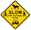 Slow Pets And People At Play Traffic Sign